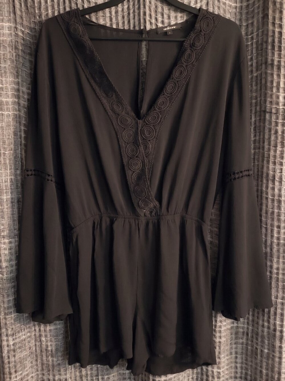 Ambiance black v neck romper in large